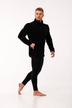 Athletic man in thermal underwear on a white background. Thermal underwear for men