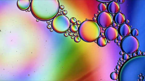 Abstract Colorful Food Oil Drops Bubbles and spheres Flowing on Water Surface Macro Photography