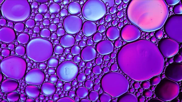 stock image Abstract Colorful Food Oil Drops Bubbles and spheres Flowing on Water Surface Macro Photography