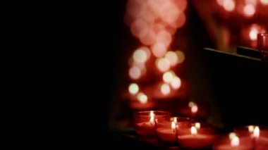 Red Wish and Pray Candles in a Catholic Church