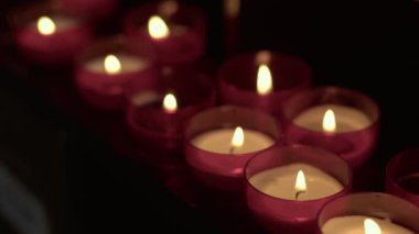 Red Wish and Pray Candles in a Catholic Church