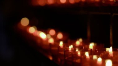 Red Wish and Pray Candles in a Catholic Church