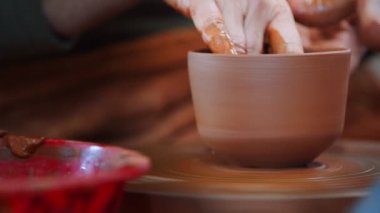 Working with Clay in Ceramic Workshop 