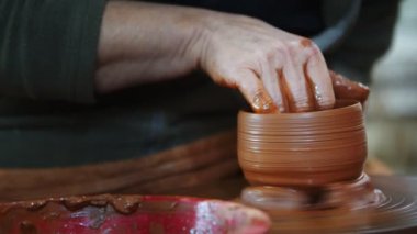 Working with Clay in Ceramic Workshop 