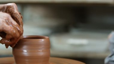 Working with Clay in Ceramic Workshop 