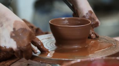 Working with Clay in Ceramic Workshop 