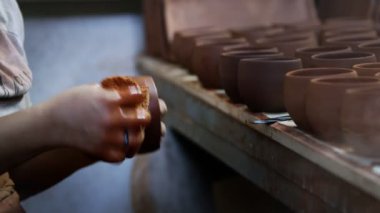 Working with Clay in Ceramic Workshop 