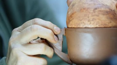 Working with Clay in Ceramic Workshop 