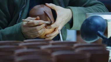 Working with Clay in Ceramic Workshop 