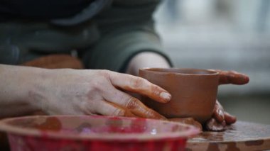 Working with Clay in Ceramic Workshop 