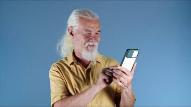 Old Man Making Video Call on the Phone Photo