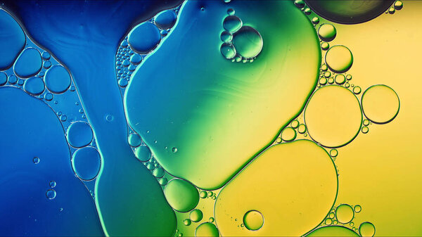 Abstract Colorful Food Oil Drops Bubbles and spheres Flowing on Water Surface, macro Photography