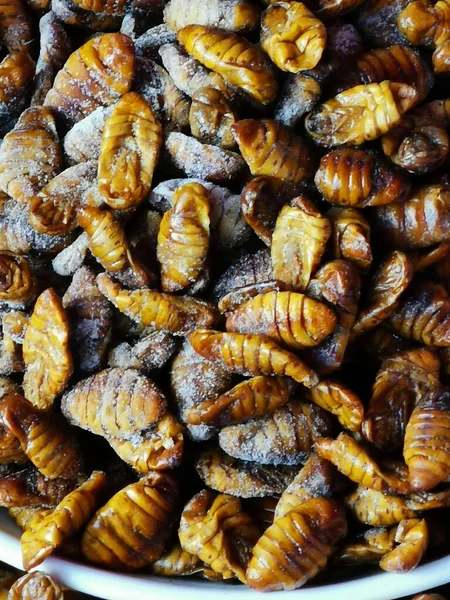 Silk worm pupae displayed for sale in South Korean market. High quality photo