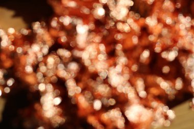 Bulanık bakır ya da gül renkli metal folyonun tam kare arkaplan resmi. Yüksek kalite fotoğraf.