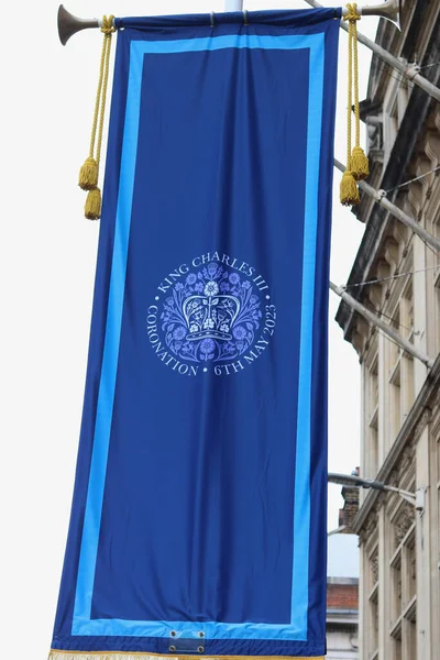 stock image 1 May 2023 - Windsor, England, UK: Vertical image of Windsor town decorated with blue banners with gold tassels for King Charless coronation. High quality photo.