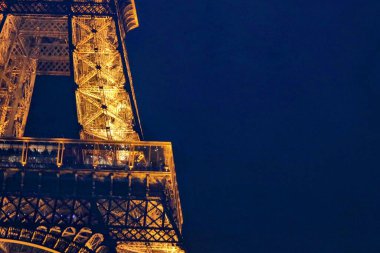 20 October 2024 - Paris, France: Section of Eiffel Tower illuminated at night. High quality photo clipart