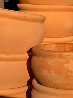 Image of close up of large round stacked pots. High quality photo clipart