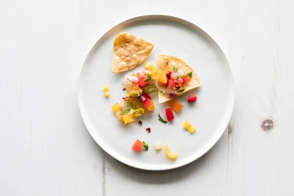 Top View Yellow Corn Tortilla Chips Topped Homemade Salsa White — Stock Photo, Image