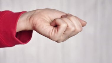 The female hand holds pills vitamins omega, spirulina, iron and is treated . Close-up and points your finger up. Nurse gives pills to the patient