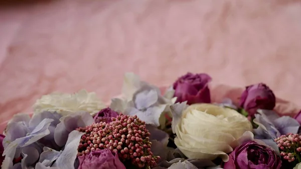 Floral natural background with blue gardenia, pink rose, white chrysanthemum close-up. Copy space, copy past, paste text