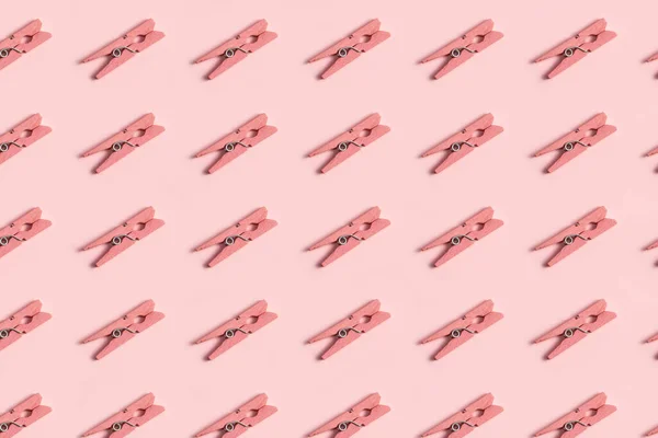 Roze Wasknijper Patroon Een Pastel Roze Achtergrond — Stockfoto