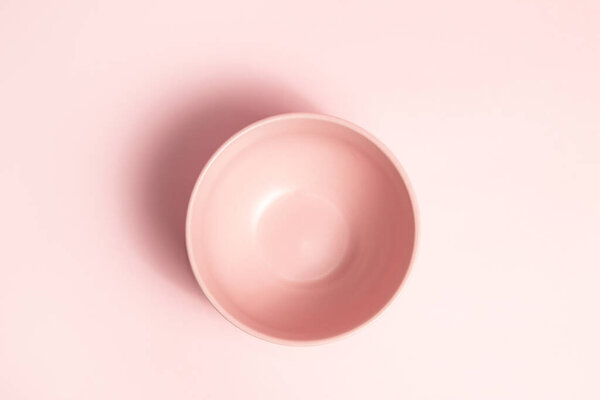 Pastel pink bowl on pink background