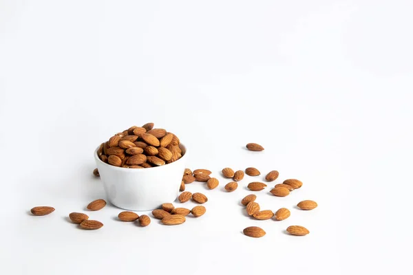 Almond Spilled White Ceramic Bowl — стоковое фото