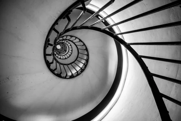 stock image Old vintage spiral staircase. Black and white photography.