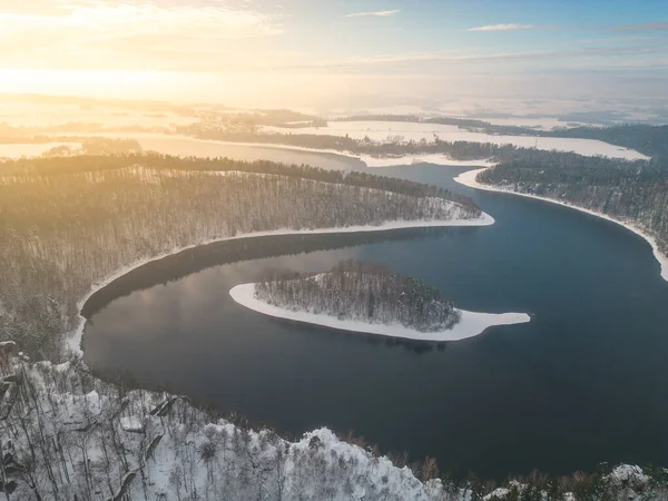 Sec water reservoir with small forested island in the middle. Iron Mountains, Czechia. Aerial view from drone.