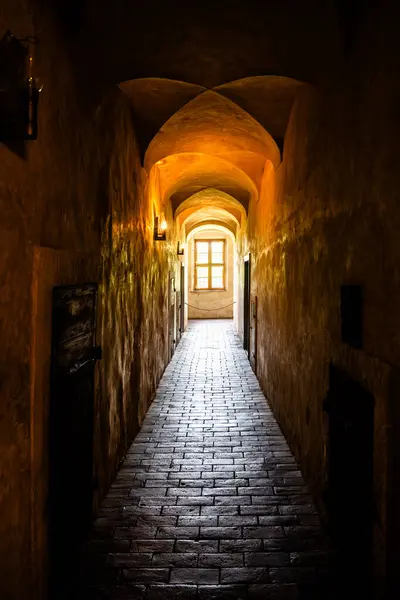 Dark and empty corridor of medieval castle