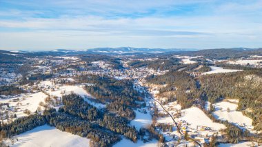 Tanvald in wintertime. Small town in Jizera Mountains, Czechia. Aerial photography from above. clipart