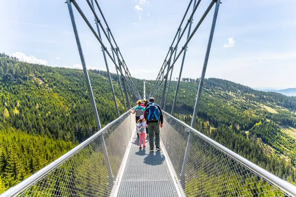 stock image The Sky Bridge 721 is the worlds longest suspension footbridge in Dolni Morava Resort, Czechia. Visitors enjoy scenic forest views as they walk.