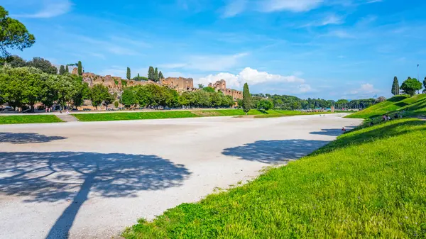 stock image The Circus Maximus, Italian: Circo Massimo, an ancient Roman chariot-racing stadium and mass entertainment place in ancient Rome, Italy. With buildings of Palatine Hill on background