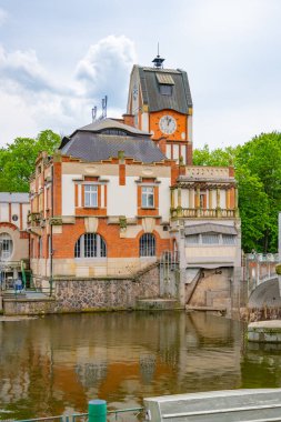 The Hucak hydroelectric power station in Hradec Kralove showcases its stunning Art Nouveau architecture, reflecting the historical significance of early 20th-century engineering by the rivers edge. clipart