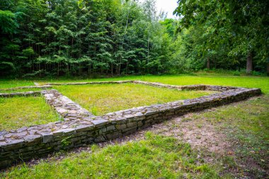 The archaeological site in Trocnov reveals the remains of Zizkas mansion, celebrating the birthplace of the famous Hussite military leader amid lush greenery. clipart