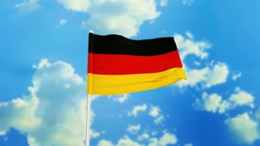 Alman bayrağı rüzgarda dalgalanırken gökyüzü arka planında
