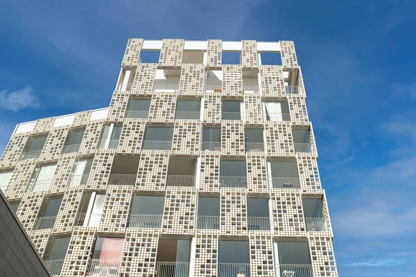 stock image Exterior of modern white openwork house. Architectural detail of close-up on windows and texture wall. Real estate, residential apartment and office. Living apartments or office building architecture.