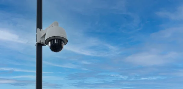Real time Modern Online Security Panoramic CCTV camera surveillance system. An outdoor video surveillance ip-camera is installed on a metal post. Equipment system service for safety life or asset.