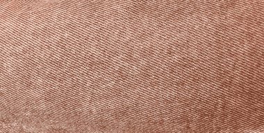 Herhangi bir arka plan için bol moka renkli kot pantolon tekstili. Soluk kumaş kotlar. Denim Material. Kumaş kot kumaşı. 2025 'in Mocha Mousse Rengi.