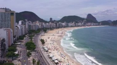 Rio de Janeiro City on Sunny Day. Copacabana Beach and Atlantic Ocean. Aerial View. Brazil. Drone Flies Forward over Avenida Atlantica