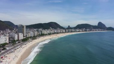 Rio de Janeiro City on Sunny Day. Copacabana Beach and Atlantic Ocean. Aerial View. Brazil. Drone Flies Forward and Upwards
