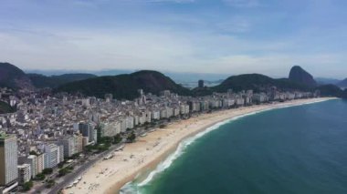 Rio de Janeiro City on Sunny Day. Copacabana Beach and Atlantic Ocean. Aerial View. Brazil. Drone Flies Backwards