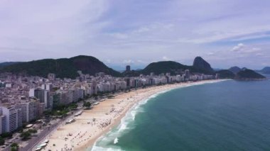 Rio de Janeiro City on Sunny Day. Copacabana Beach and Atlantic Ocean. Aerial View. Brazil. Drone Flies Forward and Upwards