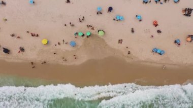 Copacabana Beach and Atlantic Ocean. Rio de Janeiro City, Brazil. Aerial View. Drone Flies Upwards. High Angle Shot