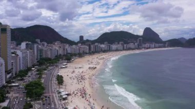 Rio de Janeiro City on Sunny Day. Copacabana Beach and Atlantic Ocean. Aerial View. Brazil. Drone Flies Forward over Avenida Atlantica