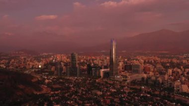 Santiago City at Evening Twilight and Andes Mountains. Blue Hour. Aerial View. Chile. Orbiting