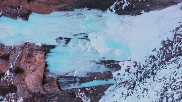 Ice Climbing Frozen Waterfall Aerial View Mountaineer Man Leading Ice — Stock Video