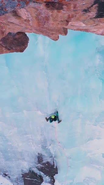 Ice Climbing Frozen Waterfall Aerial Top View Man Placing Ice — Stock Video