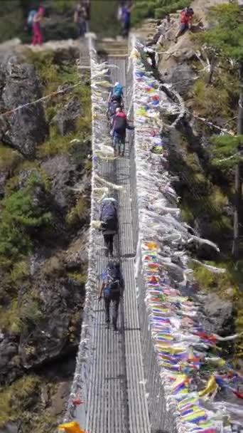 Trekkers Walking Suspension Bridge Khumbu Himalaya Nepal Slow Motion Vertical — Stock Video