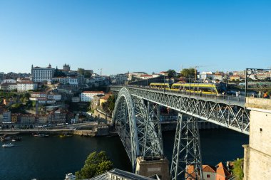 Porto City, Douro River and Dom Luis bridge I with Trams. View from Tourist Viewpoint Miradouro do Jardim do Morro. Portugal clipart